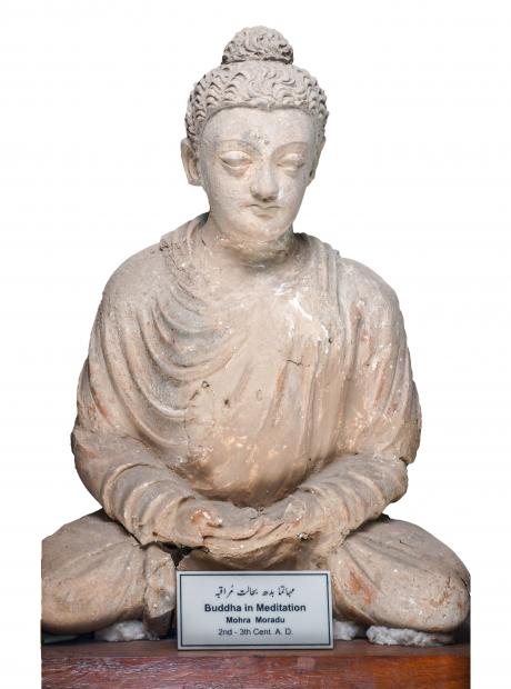 <h3>Buddha in Meditation (dhyanamudhra)</h3> <p>Stucco<br /> 3rd – 5th Century CE<br /> Mohra Moradu<br /> A stucco sculpture of the Buddha in meditation pose, with both hands resting on the lap in dhyanamudhra: the right hand is placed on top of the left hand, palms facing upwards. The gesture symbolizes wisdom, and it was in this posture during the final meditation under the Bodhi tree that Siddhārta attained enlightenment.</p>