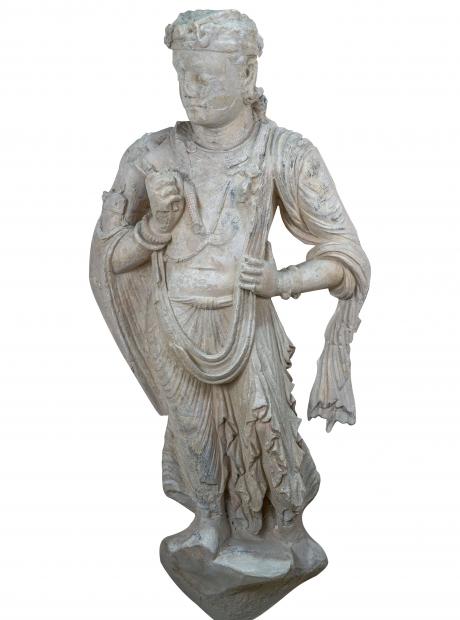 <h3>Haloed Standing Bodhisattva</h3> <p>Stucco<br /> 4rd – 5th century CE<br /> Mohra Moradu<br /> The figure of Bodhisattva has formed a distinct iconographic image in the Gandharan Buddhist tradition. The stucco sculpture depicts the Bodhisattva in princely attire, adorned with jewelry. The large halo encircling his head apart from reinforcing the royal status of the figure, also alludes to the Buddhist symbolism of light.</p>