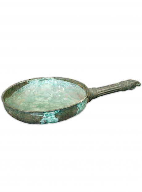 <h3>Metal Frying pan</h3>  <p>The ancient metal smiths were experts in producing alloys of all sorts of metals, which were put to various uses. The circular metal pots with long, carved handles were used as incense burners or as cookware in ancient Gandhara.</p>
