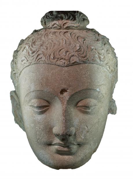 <h3>Smiling Buddha Face</h3> <p>Stucco<br /> 2nd – 4th century CE<br /> Jaulian<br /> The stucco head portrays the Buddha in contemplation in a characteristic style. With a well-preserved surface, the head sports the ushnisha (protuberance at the top of the head representing spiritual power and wisdom) and the urna (a circular depression at the centre of forehead representing light and spiritual wisdom).</p>
