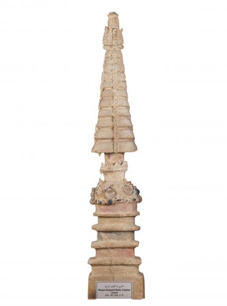 <h3>Stupa Shaped Reliquary</h3> <p>2nd-4th Cent. AD<br /> Jaulian<br /> Reliquaries are small storage caskets that were originally placed inside a stupa. They contained relics of the Buddha (and other important Buddhist figures) in the form of ashes, bones, and sacred objects associated with him. This stupa shaped relic casket from Jaulian, built in a circular plan with several levels, is a unique artifact. It is studded with precious stones, signifying its use to hold the ashes of a holy figure.</p>